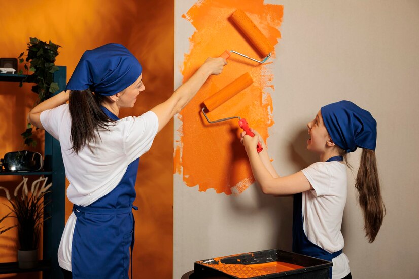 happy-family-painting-orange-walls home renovation austin
